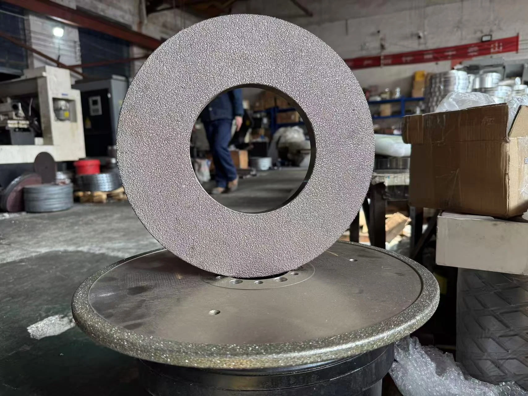 User-supplied abrasive wheel photograph in a workshop setting; model unidentified